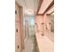 Bathroom with a shower, a sink, a large mirror and wallpaper at 622 Elizabeth Ln, Lakeland, FL 33809