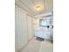 Bathroom with a vanity, a mirror and wallpaper at 622 Elizabeth Ln, Lakeland, FL 33809