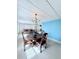 Bright dining area featuring a dark wood table with carved chairs and a bright accent wall at 622 Elizabeth Ln, Lakeland, FL 33809