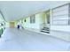 Covered parking area with stairs leading to front door at 622 Elizabeth Ln, Lakeland, FL 33809