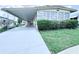 View of home with covered parking and manicured front lawn at 622 Elizabeth Ln, Lakeland, FL 33809