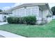 Attractive home with a well-manicured lawn and mature landscaping at 622 Elizabeth Ln, Lakeland, FL 33809