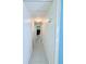 Bright hallway featuring neutral paint, tile floors, and an overhead light at 622 Elizabeth Ln, Lakeland, FL 33809
