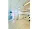 Bright kitchen features white cabinets and modern appliances with tile floors at 622 Elizabeth Ln, Lakeland, FL 33809