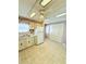 Spacious kitchen with white appliances and access to the laundry room at 622 Elizabeth Ln, Lakeland, FL 33809