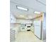 Functional kitchen with ample cabinet space and modern white appliances at 622 Elizabeth Ln, Lakeland, FL 33809