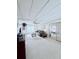 Bright living room with a brown sofa, mirrored closet and plush carpet at 622 Elizabeth Ln, Lakeland, FL 33809