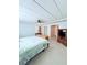 Spacious main bedroom with carpet, a ceiling fan and an attached bathroom at 622 Elizabeth Ln, Lakeland, FL 33809
