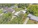 This aerial view showcases the house, sheds, and backyard at 640 Forrest Dr, Bartow, FL 33830