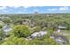 Aerial view of the neighborhood, this home, and surrounding greenery at 640 Forrest Dr, Bartow, FL 33830