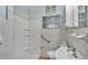 A bathroom with a shower, toilet, sink, and grab bar at 640 Forrest Dr, Bartow, FL 33830