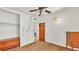 Bedroom with a dresser, closet, and doorway to the bathroom at 640 Forrest Dr, Bartow, FL 33830