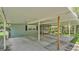 Spacious covered carport with a screened porch and access to the home's exterior at 640 Forrest Dr, Bartow, FL 33830