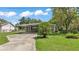 Charming single-story home with a covered carport and well-maintained front lawn at 640 Forrest Dr, Bartow, FL 33830