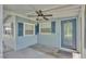 Charming front porch with a ceiling fan and a welcoming blue door at 640 Forrest Dr, Bartow, FL 33830