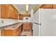 Kitchen showcasing the ample counter space, wood cabinets, and standard appliances at 640 Forrest Dr, Bartow, FL 33830