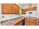 Kitchen showcasing the ample counter space, wood cabinets, and a built-in microwave oven at 640 Forrest Dr, Bartow, FL 33830