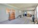 This living room has carpet, bright windows, and a door to the outdoors at 640 Forrest Dr, Bartow, FL 33830