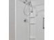 Bathroom shower with shelving, grab bar and adjustable shower head at 640 Forrest Dr, Bartow, FL 33830