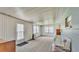 Sun room with carpeting, white siding, natural light from windows and back door at 640 Forrest Dr, Bartow, FL 33830
