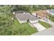 Aerial view of the property showcasing the home, yard, and surrounding neighborhood at 6406 Butternut Dr, Lakeland, FL 33813