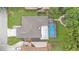 An aerial view showing the house roof and screened-in pool at 6406 Butternut Dr, Lakeland, FL 33813