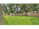 Well-maintained backyard featuring a large lawn and a storage shed at 6406 Butternut Dr, Lakeland, FL 33813