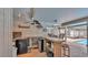 Outdoor bar with bar stools, beverage refrigerators, and access to the pool at 6406 Butternut Dr, Lakeland, FL 33813