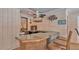 Outdoor bar with a sink, beverage refrigerators, and decorative signs at 6406 Butternut Dr, Lakeland, FL 33813