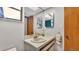 Bright bathroom featuring decorative tile, sink, and a view of the shower at 6406 Butternut Dr, Lakeland, FL 33813