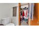 Shower and closet combination bathroom with tile floors and walls at 6406 Butternut Dr, Lakeland, FL 33813