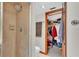 Shower and closet combination bathroom with tile floors and walls at 6406 Butternut Dr, Lakeland, FL 33813