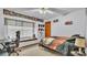 This carpeted bedroom features a ceiling fan, window seat, and baseball theme at 6406 Butternut Dr, Lakeland, FL 33813