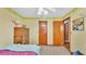 Bedroom featuring pastel wallpaper and an expansive wooden cabinet at 6406 Butternut Dr, Lakeland, FL 33813
