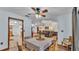 This dining room has hardwood floors and it opens to the living room, creating an open, airy feel at 6406 Butternut Dr, Lakeland, FL 33813