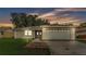 Charming single-story home featuring an attached two-car garage and a well-maintained front yard at 6406 Butternut Dr, Lakeland, FL 33813