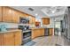 This kitchen features modern appliances, wood cabinets, and tiled flooring, making it a welcoming space at 6406 Butternut Dr, Lakeland, FL 33813