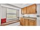 Bright kitchen nook features a window bench, and cabinets with countertop, offering storage and natural light at 6406 Butternut Dr, Lakeland, FL 33813