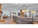 Bright and spacious living room with hardwood flooring and a fireplace, creating an inviting atmosphere for gatherings at 6406 Butternut Dr, Lakeland, FL 33813