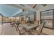 Covered outdoor patio with dining area and ceiling fans, perfect for entertaining at 6406 Butternut Dr, Lakeland, FL 33813