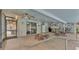 Spacious screened patio with ceiling fans and comfortable seating area at 6406 Butternut Dr, Lakeland, FL 33813