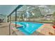 Relaxing screened-in pool area with access steps, perfect for hot days at 6406 Butternut Dr, Lakeland, FL 33813
