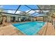 Spacious screened-in pool and patio with seating, offering a serene retreat at 6406 Butternut Dr, Lakeland, FL 33813