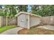 A small shed with double doors, providing extra storage space at 6406 Butternut Dr, Lakeland, FL 33813