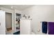 Bright bathroom featuring tile floors, shelves, and vanity at 6421 Calusa Dr, Lakeland, FL 33813