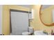 Small bathroom featuring a shower and a round mirror above the sink at 6421 Calusa Dr, Lakeland, FL 33813