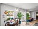 Bright dining area with tile floors, plants, and an outdoor view to the pool at 6421 Calusa Dr, Lakeland, FL 33813