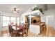 Bright dining room with a ceiling fan, dining table, and kitchen bar at 6421 Calusa Dr, Lakeland, FL 33813