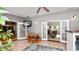Bright dining room featuring tile floors, an open layout to the living room, and a ceiling fan at 6421 Calusa Dr, Lakeland, FL 33813