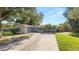 Charming single-story home with a well-maintained lawn and a driveway at 6421 Calusa Dr, Lakeland, FL 33813